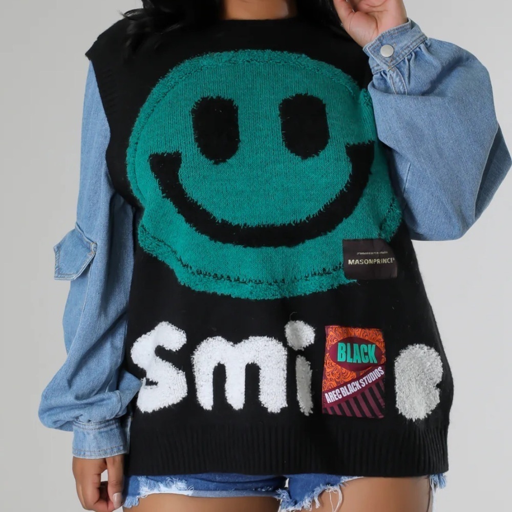 Black and Green Smiley Face Sweater with denim sleeves. Small/medium